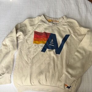 Woman’s  Cream Sweater with Graphic Design